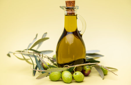 olive oil with a sprig of olivesの写真素材