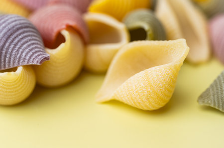 colored pasta shells close up