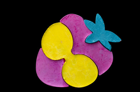 multi-colored object on a black background