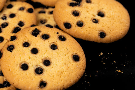 chocolate chip cookies on black background