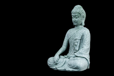 Buddha statue isolated on black backgroundの写真素材