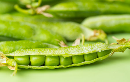 young green pea pods close upの写真素材