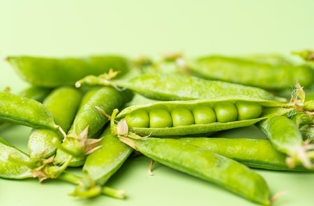 young green pea pods close up