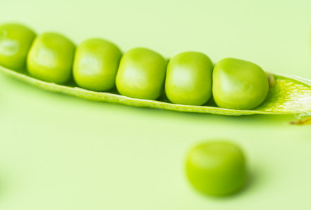 young green pea pods close upの写真素材