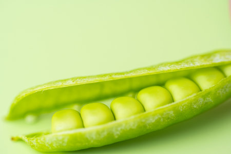 young green pea pods close upの写真素材