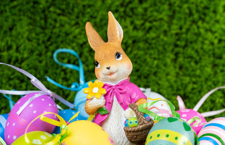 Easter egg with a bunny on a green background
