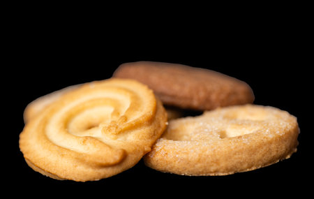 Butter cookies isolated on a black background