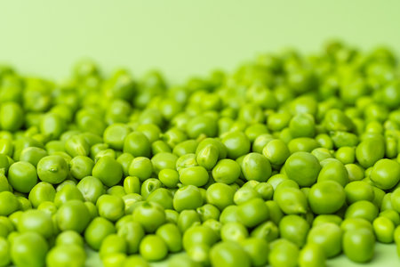 A close-up photo of fresh green peas