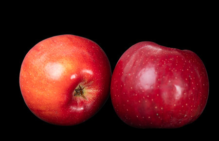 red apple on a black background