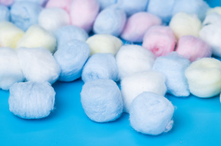 cotton balls on a blue backgroundの写真素材