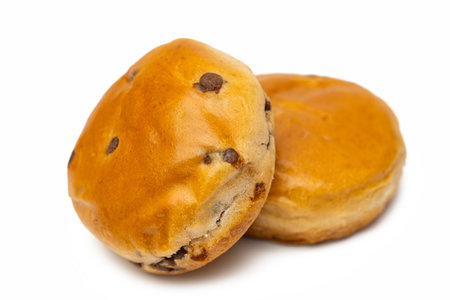 Bun with chocolate chips isolated on white backgroundの写真素材