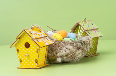 Easter decoration of a bird's nest on a green background