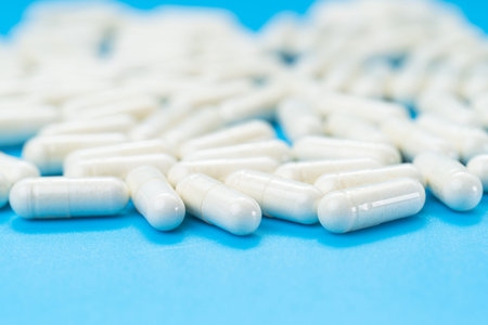 white capsules on a blue background