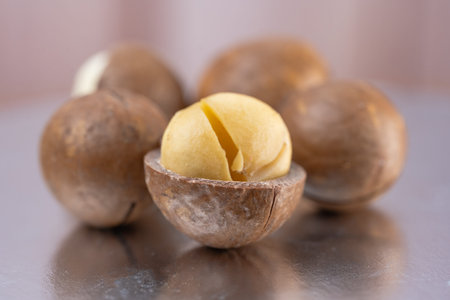 Whole unpeeled macadamia nuts close up