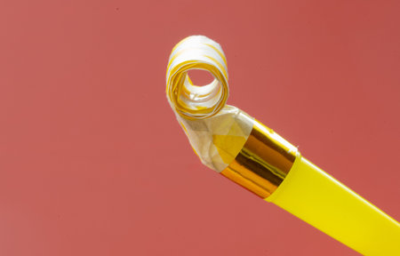 A close-up photo of a festive whistle