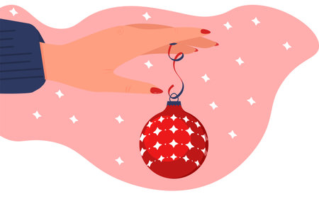 Christmas decor.Christmas ball holding in hand.New Year gift.のイラスト素材