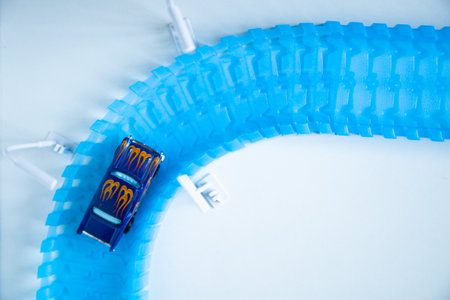 Close-up view of a plastic toy car on a white backgroundの写真素材