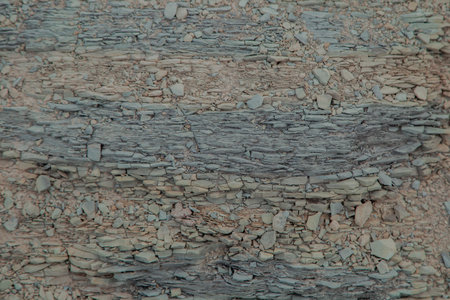 Texture of weathered stone with pebbles. Abstract background for design.