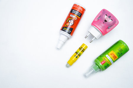 Mosquito repellents are lying in a corner on a white backgroundのeditorial素材