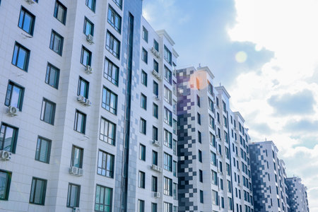 The buildings have a modern design with white and gray facades and many windows. Air conditioning is...