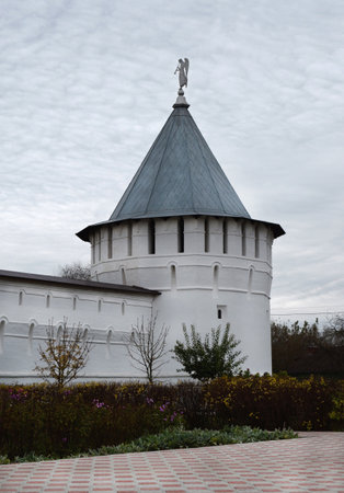 Tower and wall of Vysotsky monastery on the background of grey sky in Serpukhov, Russia.の写真素材