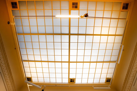 Glass roof skylight window of modern building, abstract architectural backgroundの写真素材
