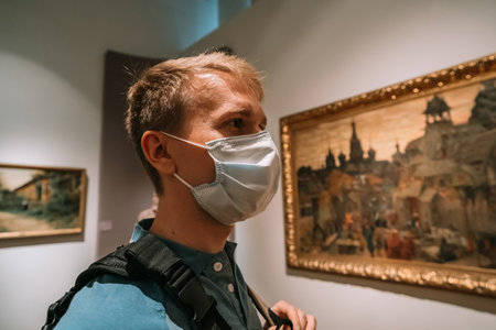 A young man in a medical mask went to an art gallery, Russian Museumのeditorial素材