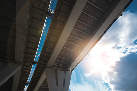 Metal structure of the bridge, photo from the bottom of the automobile bridgeの写真素材
