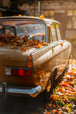 Retro car skidded autumn colored leaves in the Park, romantic autumn landscapeの写真素材