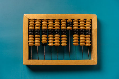 Top view of vintage abacus on a green background, the concept of mathematical calculationsの写真素材