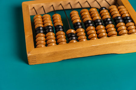 Top view of vintage abacus on a green background, the concept of mathematical calculationsの写真素材