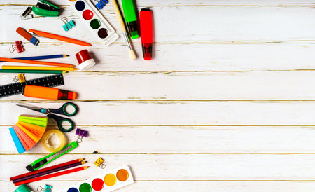 School stationery or office supplies on a wooden background.の写真素材