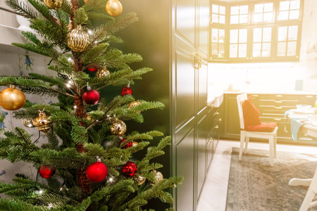 Decorated Christmas tree in a cozy homeの写真素材