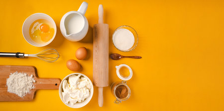 Ingredients and baking tools on a yellow background, top view. Cooking concept banner with copy space for textの写真素材