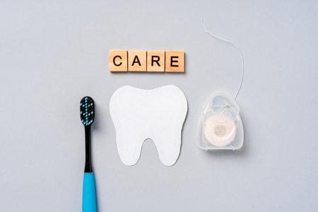 Dental care accessories: mouth guard, toothbrush, dental floss, dental concept on blue backgroundの写真素材