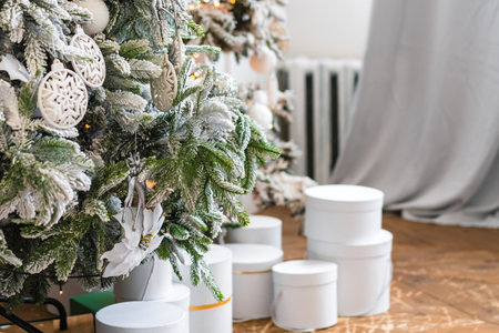Bright room with a luxurious decorated Christmas tree and New Year's decoration