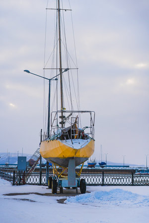 Yachts and boats are stored in winter. Frozen riverの写真素材