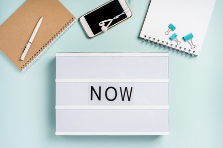 LED lamp with letter "NOW", a motivational phrase. Here and now abstract concept.の写真素材