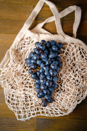 Grapes on a mesh shopping bag, delicious healthy foodの写真素材