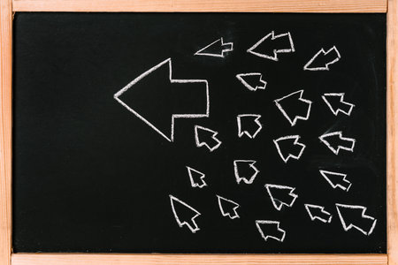 Growth chart with an arrow on a chalkboard, the concept of business solutions and meetings