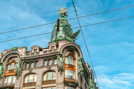 A busy street in the center of St. Petersburg on a sunny winter day, a view of the Singer(Zinger) house.のeditorial素材