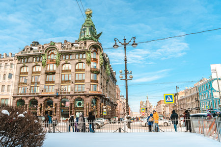 A busy street in the center of St. Petersburg on a sunny winter day, a view of the Singer(Zinger) house.のeditorial素材