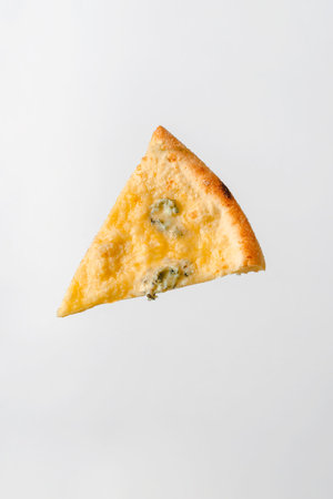 A slice of pizza with different cheeses and cheese with mold hangs in the air on a white isolated backgroundの写真素材
