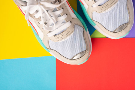 A pair of sneakers on a colored background. Top view and place for text, sports conceptの写真素材