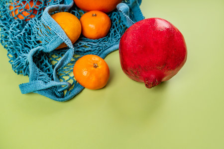 Citrus fruits in a cotton eco-bag on a background. The concept of a healthy lifestyle and freshnessの写真素材