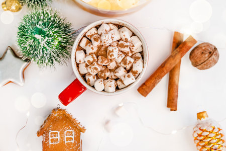 Christmas composition of toys, cones and cocoa mugs on a white background. A festive frame for your...
