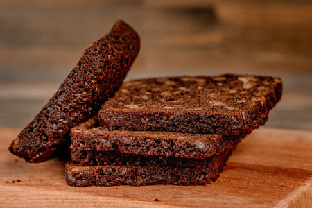 Multi-grain black bread on a wooden board