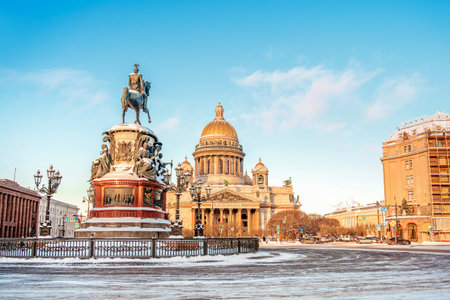 View of the monument to Nicholas I and St. Isaac's Cathedral on a snowy winter day in St. Petersburg. Postcard tourist viewのeditorial素材