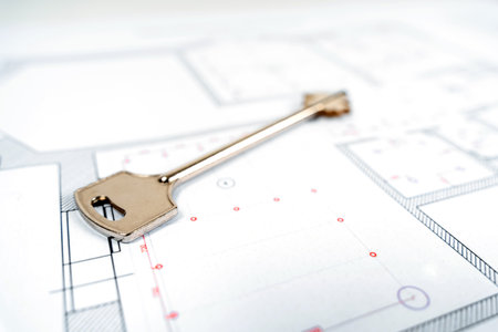 The key to a new house or apartment lies on the design drawing of the apartment plan. Real estate sales and symbolsの写真素材