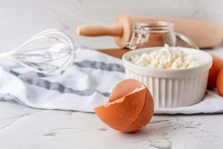 Baking homemade sweets on white table with ingredients for cooking, culinary background, copy space,...